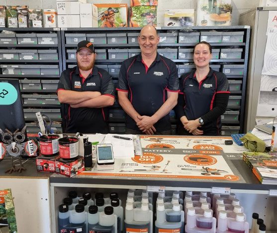 Urunga Chainsaw & Mower Shop Front With Friendly Team and Staff — Urunga Chainsaw & Mower in Urunga, NSW